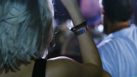 group of people dancing at a concert 4k