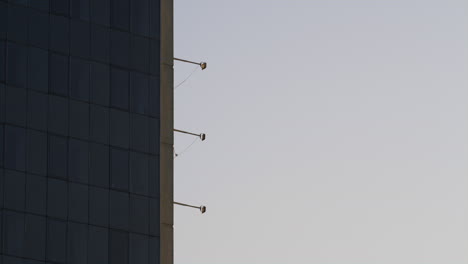 office building glass exterior at golden hour drone shot. city architecture.