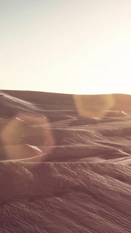 sunset over desert dunes