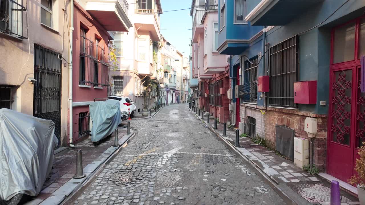 Charming Cobblestone Street with Colorful Buildings and Street Art