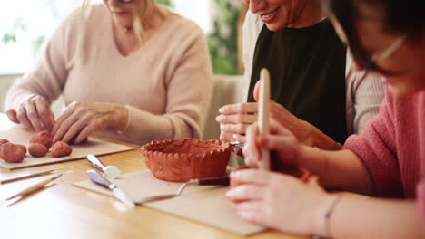 women enjoying a pottery class