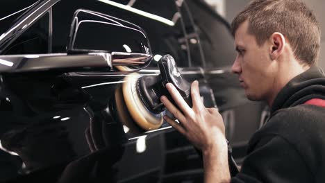 Polishing-a-black-new-car.