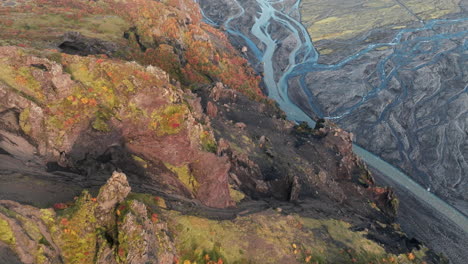 flyover above cliffs, river valley of thorsmork, iceland, or the valley of thor