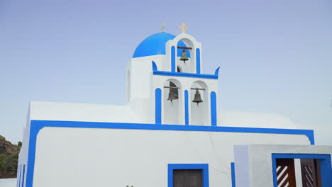 Beautifully-painted-Greek-church-with-three-church-bells