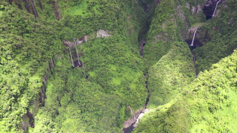 aerial view over the takamaka waterfalls on the marsouins river, reunion island