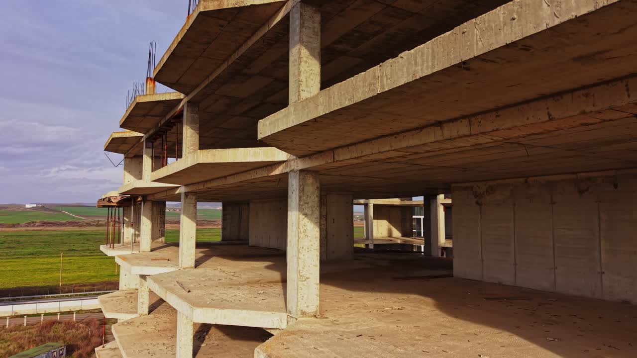 Construction site view of unfinished building with open floors