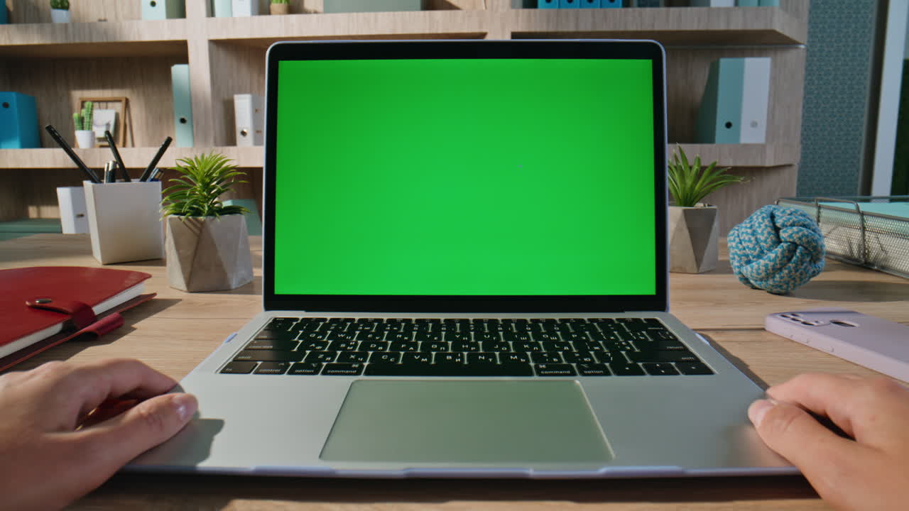 Man looking green screen laptop video at company workplace closeup zoom in