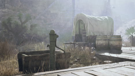 vintage western water pump and wagon scene