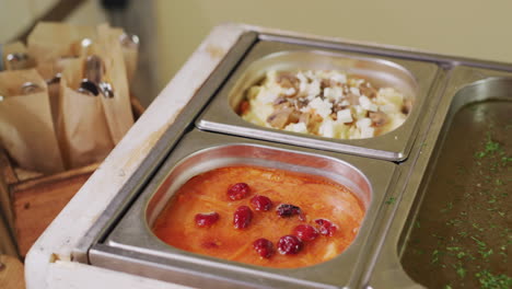 buffet with various dishes in a self-service restaurant. slider shot