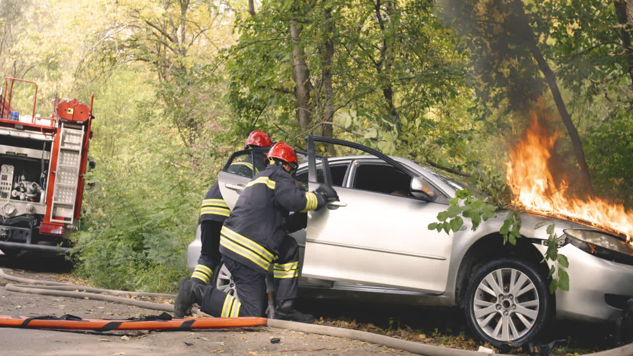 Firefighters Rescue Victims from Car Crash in Forest