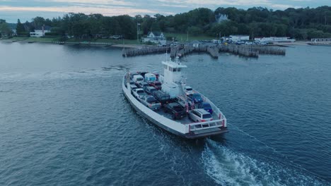 aerial drone shot of ferry approaching shelter island north fork long island new york before sunrise