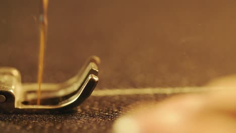 Close-up-shot-of-sewing-machine-to-sew-jeans