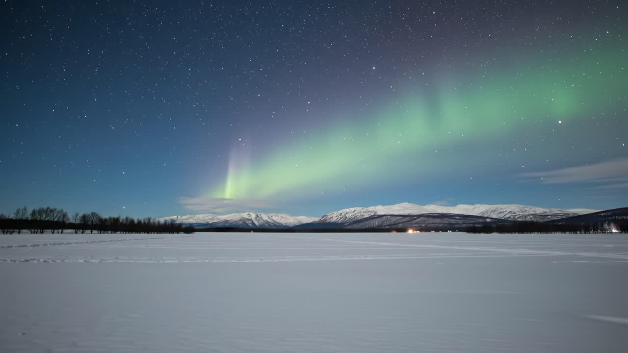 Mesmerizing Northern Lights Dancing Across a Clear Winter Sky Over a Snow-Covered Landscape, Illuminating the Serene Atmosphere with Vibrant Colors and Starry Nights