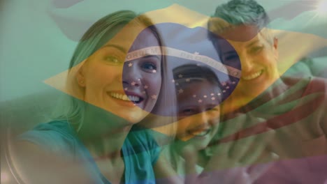 animation of flag of brazil over caucasian family