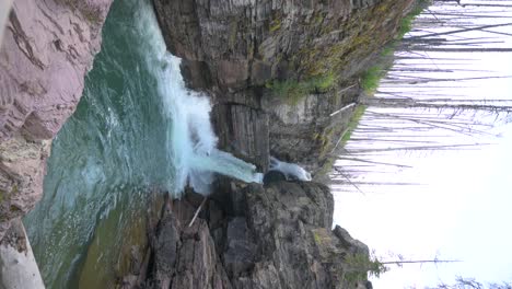 St-Mary-Falls-in-Glacier-National-Park-on-an-overcast-day,-vertical