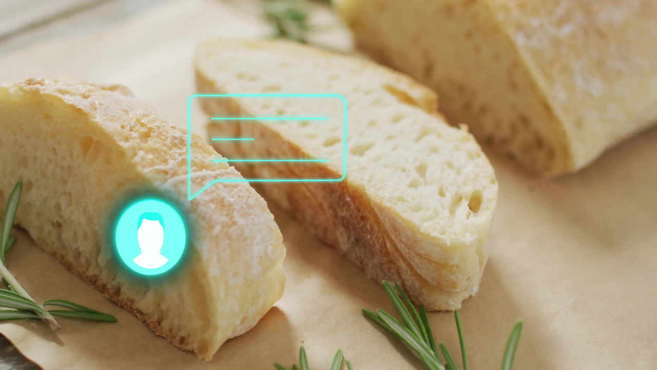 Sliced bread with digital chat icon animation over rosemary sprigs