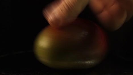 close-up of spinning mango fruit on a black background-1