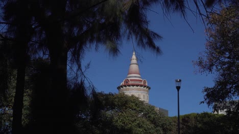 Water-Tower-seen-through-Vegetation-in-Barcelona-on-a-Clear-Day