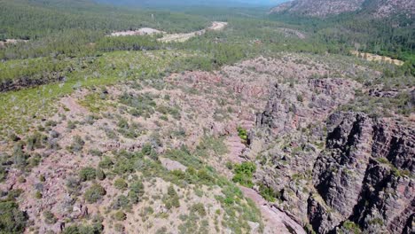 Arizona-drone-video-of-mountains,-desert,-and-cactus-with-a-flowing-creek