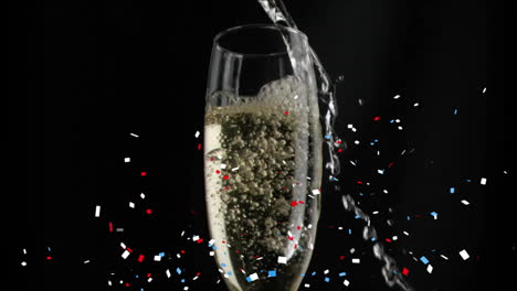 Animation-of-confetti-falling-over-champagne-glass