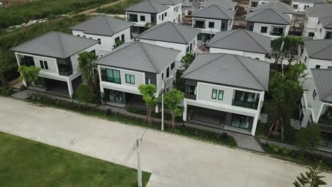 aerial footage of white and gray modern comtemporary house