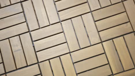 Tracking-Over-Wooden-Tiled-Flooring-Of-A-Terrace