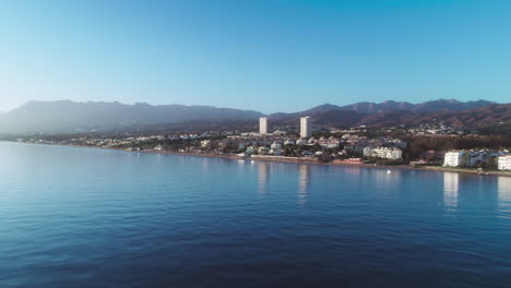 aerial over the coastline of cabopino, marbella, spain