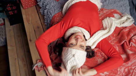 charming woman laying on bed smiling and posing. lady looking at camera. new year video.