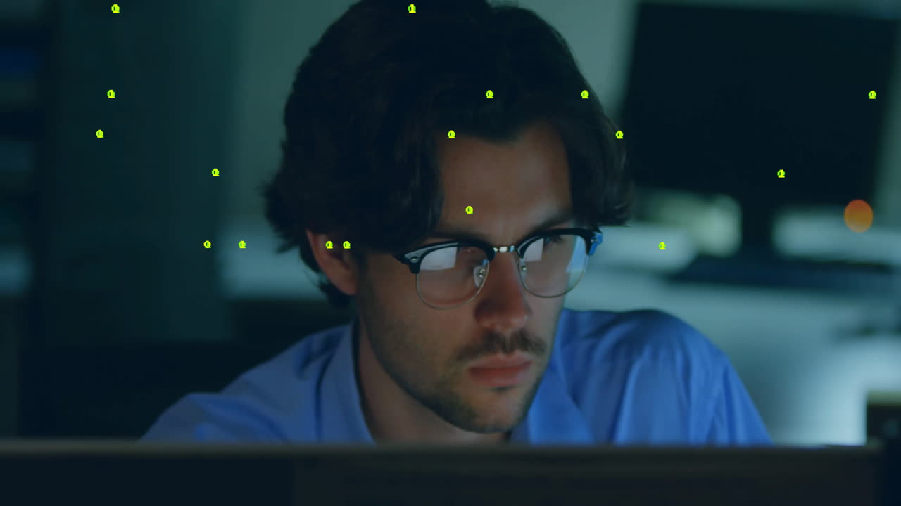 software engineer gazing at monitor in dim office, showcasing floating green binary overlay