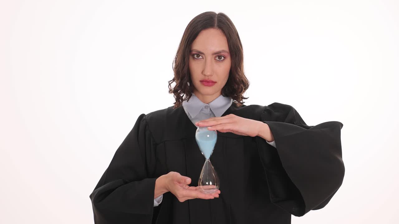 Woman in Judge Robe Holding Hourglass