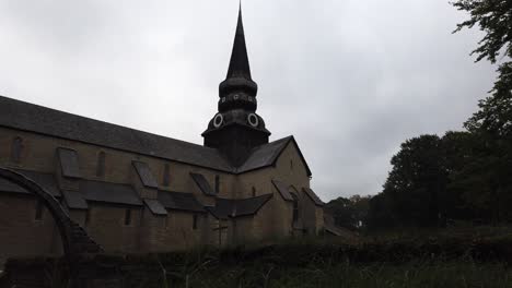 The-Monastery-of-Varnhem-built-around-1040s-in-side-gimbal-shot-view-of-monastery-building-with-beautiful-tower