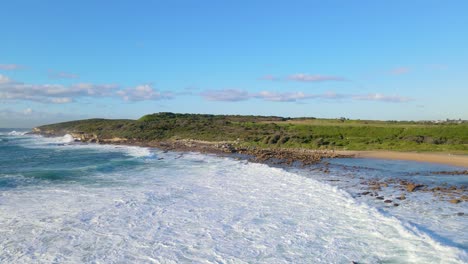 malabar headland national park - blue ocean waves and headland in maroubra suburb, sydney, australia