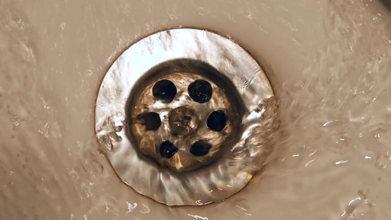 Water Draining into Sink Drain