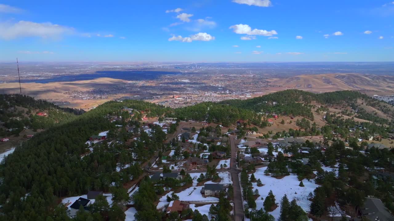 Denver city Front Range Lookout Mountain Genesse Morrison Evergreen aerial drone view Colorado Golden Gate Canyon power lines winter sunny cloudy afternoon Buffalo Bills Grave blue sky forward motion