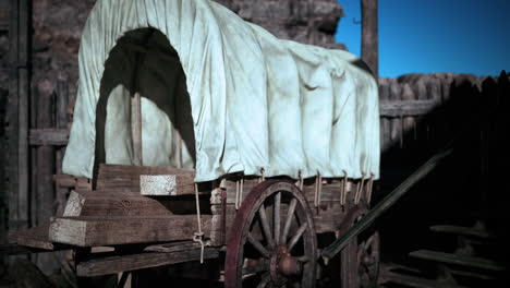 a covered wagon in a western setting