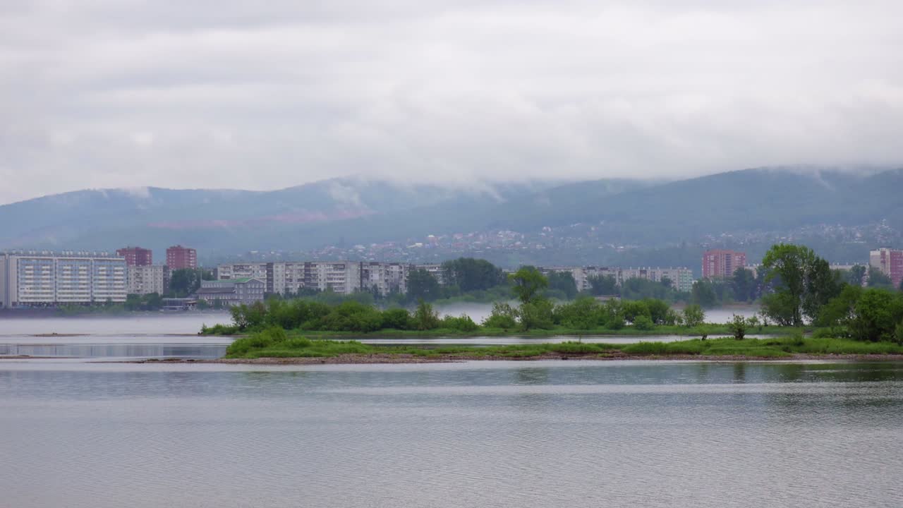 Fog movement over the river in the city
