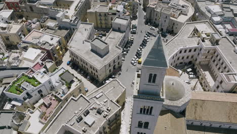 aerial footage rotating around the cross and steeple of basilica cattedrale metropolitana primaziale san sabino in bari, italy