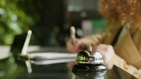 Close-up-view-of-reception-bell-on-a-counter