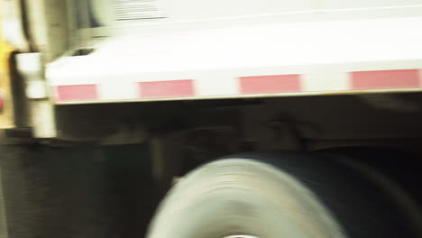 View-of-a-garbage-truck-passing-by-after-keeping-a-black-trash-box-close-to-the-camping-site-in-Glacier-NP-Campground-and-Creek-in-United-States