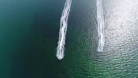 drone fly over of jet skis on water