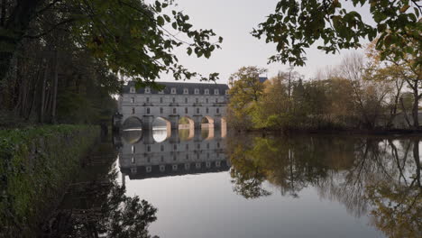 stunning reflection of a castle bridge over calm water