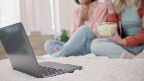 laptop, movie and women friends on a bed