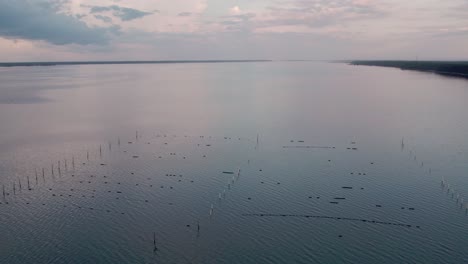 Aerial-landscape-of-estuary-waters-with-oyster-farm-beds