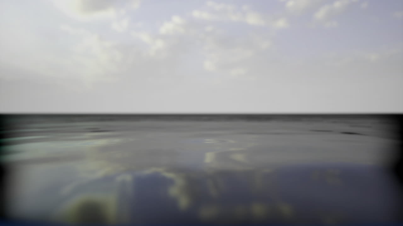 Calm water reflects clouds in a serene coastal landscape at dusk