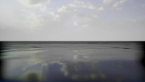 calm water reflects clouds in a serene coastal landscape at dusk