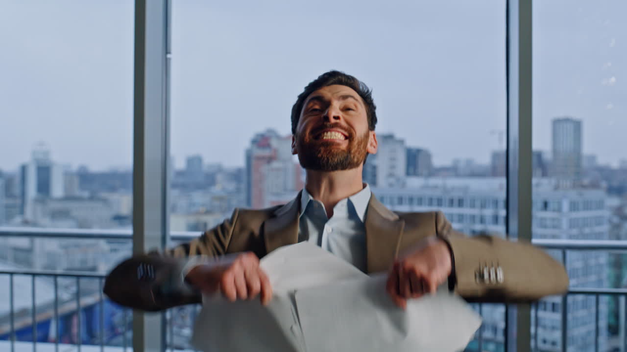 Executive examining documents feeling excitement at panorama office portrait