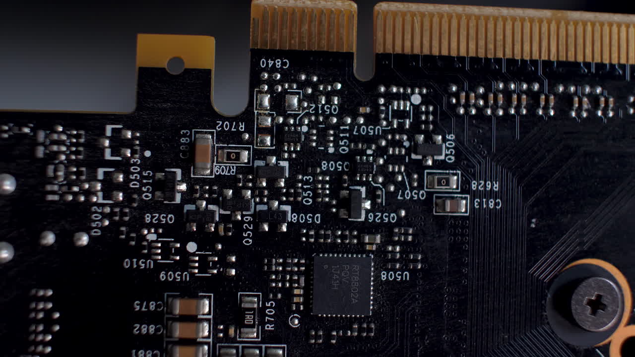 Close-up of an SLI interface on the back of a graphics card, detailing the circuitry and PCB layout, tech-focused