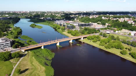 aerial view of traffic on petras vileisis bridge, kaunas, lithuania on sunny summer day, drone shot 60fps