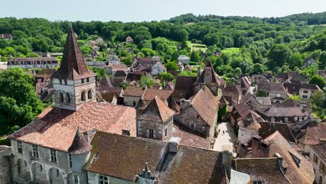 small, medieval village situated next to a river, flowing through a rich forest in the heart of france