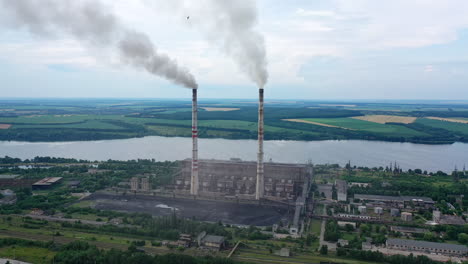 aerial view of big factory territory with huge tubes. industrial architecture factory warehouses.